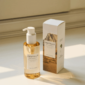 Texture and drop of SKIN1004 Light Cleansing Oil on skin