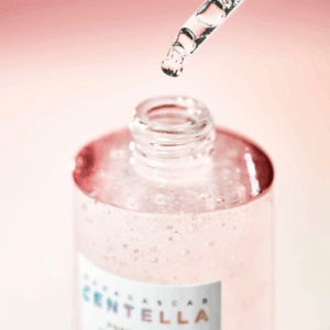 Clear watery texture of SKIN1004 ampoule on hand