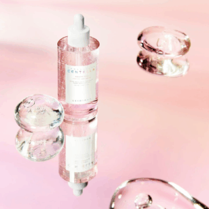 Dropper dispensing SKIN1004 ampoule with soft pink packaging