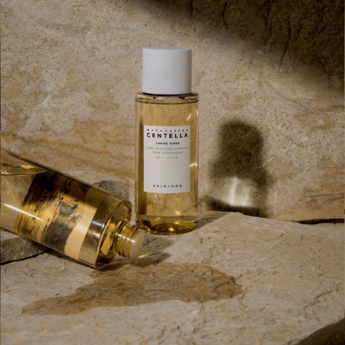 Applying SKIN1004 Toning Toner to face after cleansing