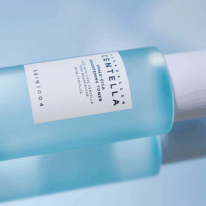 Applying SKIN1004 Hyalu-Cica Brightening Toner to dull skin